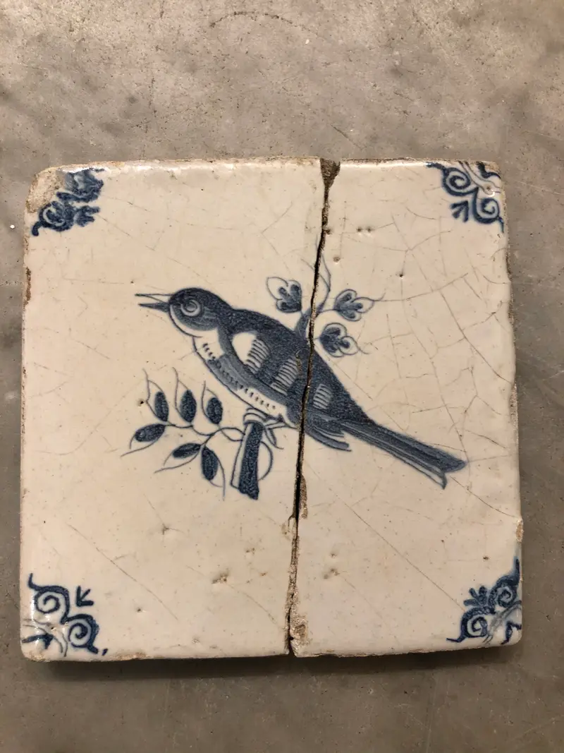 17 th century delft tile with bird handpainted
