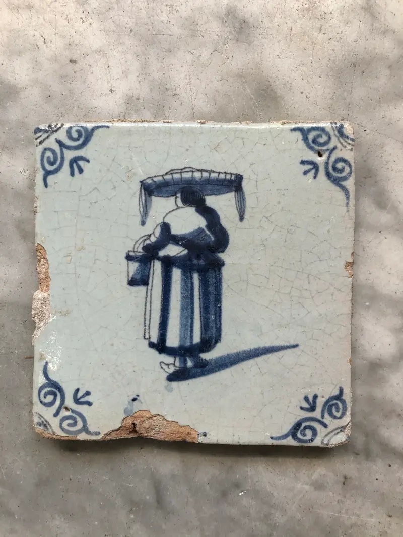 17th century Delft handpainted dutch tile with woman