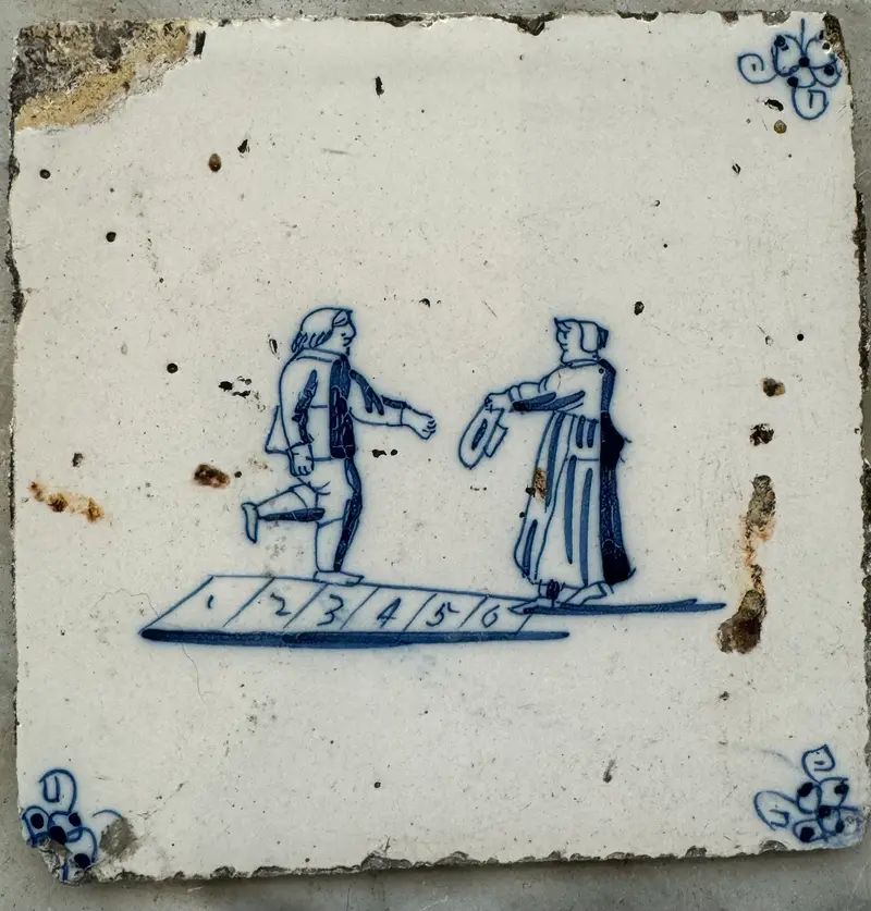 T49)18th century delft tile withchildren playing